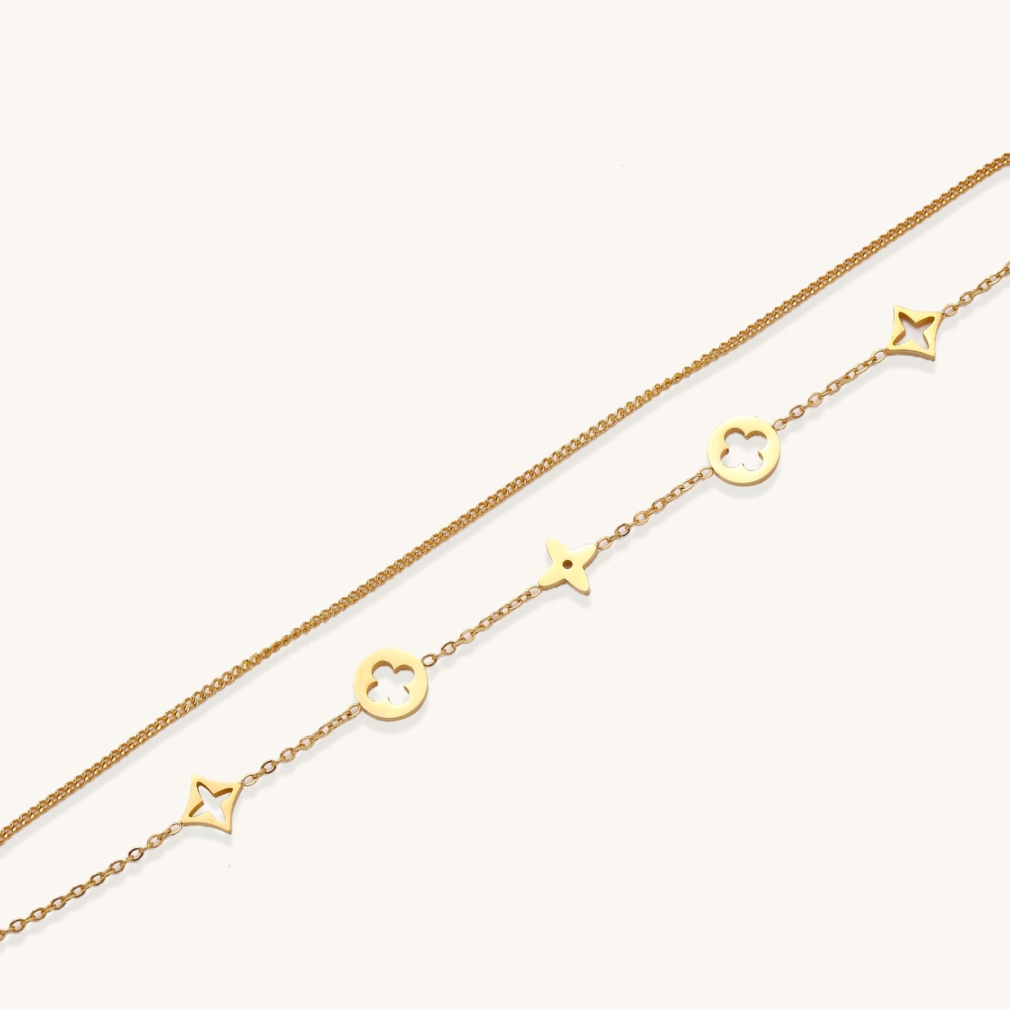 Dainty gold-plated bracelet with star and clover charms on double chain with adjustable extender