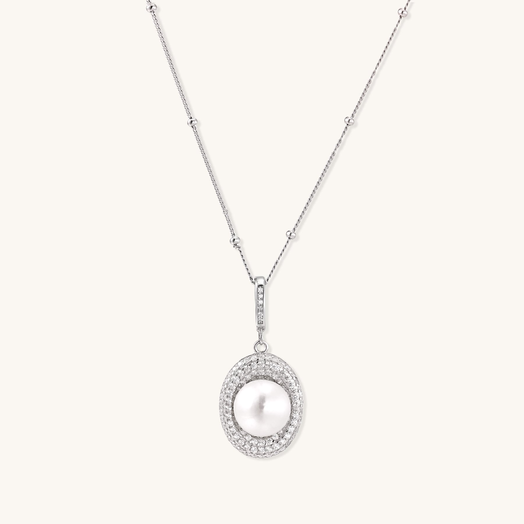 Sterling silver necklace with freshwater pearl in sparkling crystal halo pendant on delicate beaded chain
