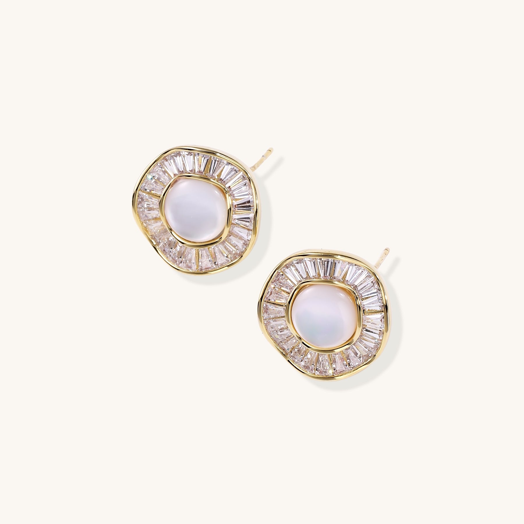Gold-plated stud earrings with central freshwater pearl surrounded by baguette crystals in radial pattern