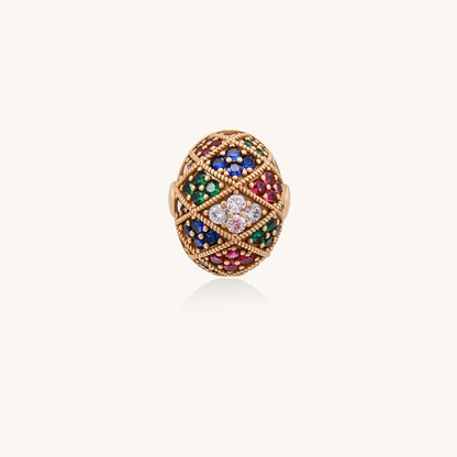 Domed gold-plated ring with geometric mosaic pattern featuring blue, green, red and clear zirconia stones in diamond settings