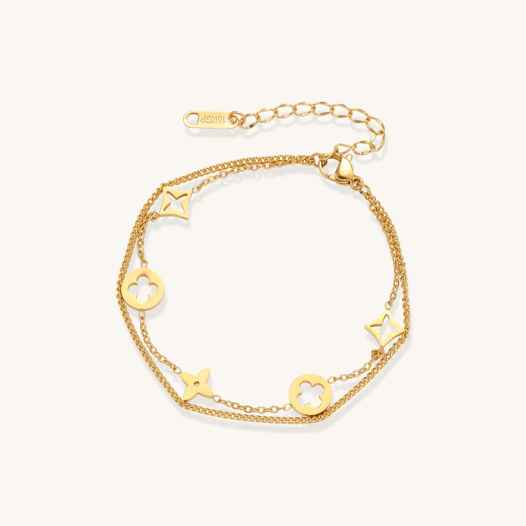 Dainty gold-plated bracelet with star and clover charms on double chain with adjustable extender