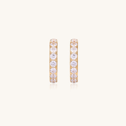 Gold-plated hoop earrings with crystal pavé and floating freshwater pearls inside the circular design.