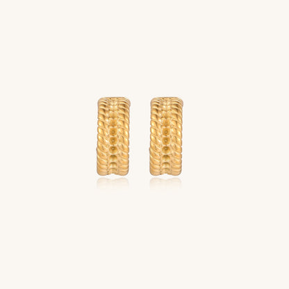 Close-up of 14K gold plated textured hoop earrings with rope pattern against cream background showing convertible design