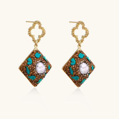 Gold quatrefoil stud earrings with ornate square pendants featuring turquoise stones and freshwater pearls