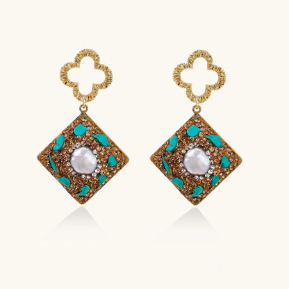 Gold quatrefoil stud earrings with ornate square pendants featuring turquoise stones and freshwater pearls
