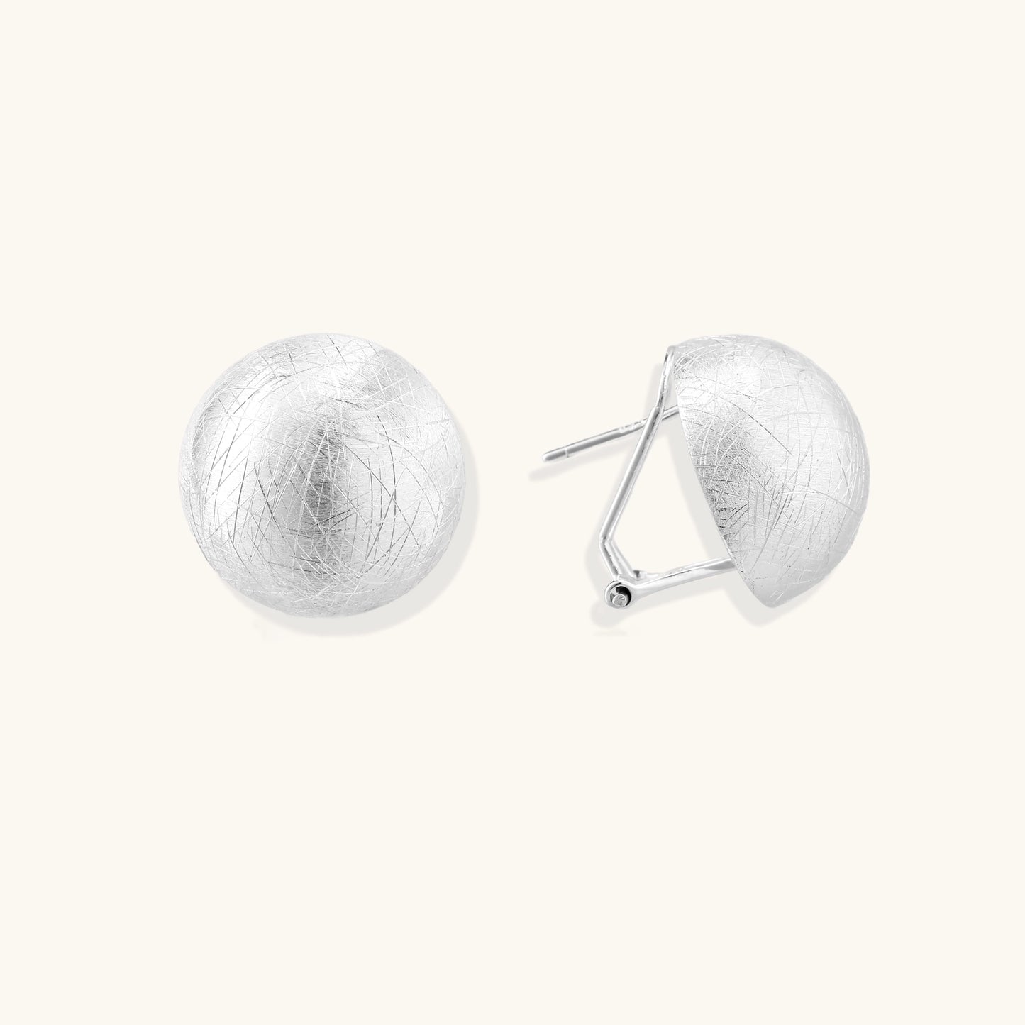 Brushed sterling silver dome-shaped stud earrings with textured surface and secure lever-back closure on white background.