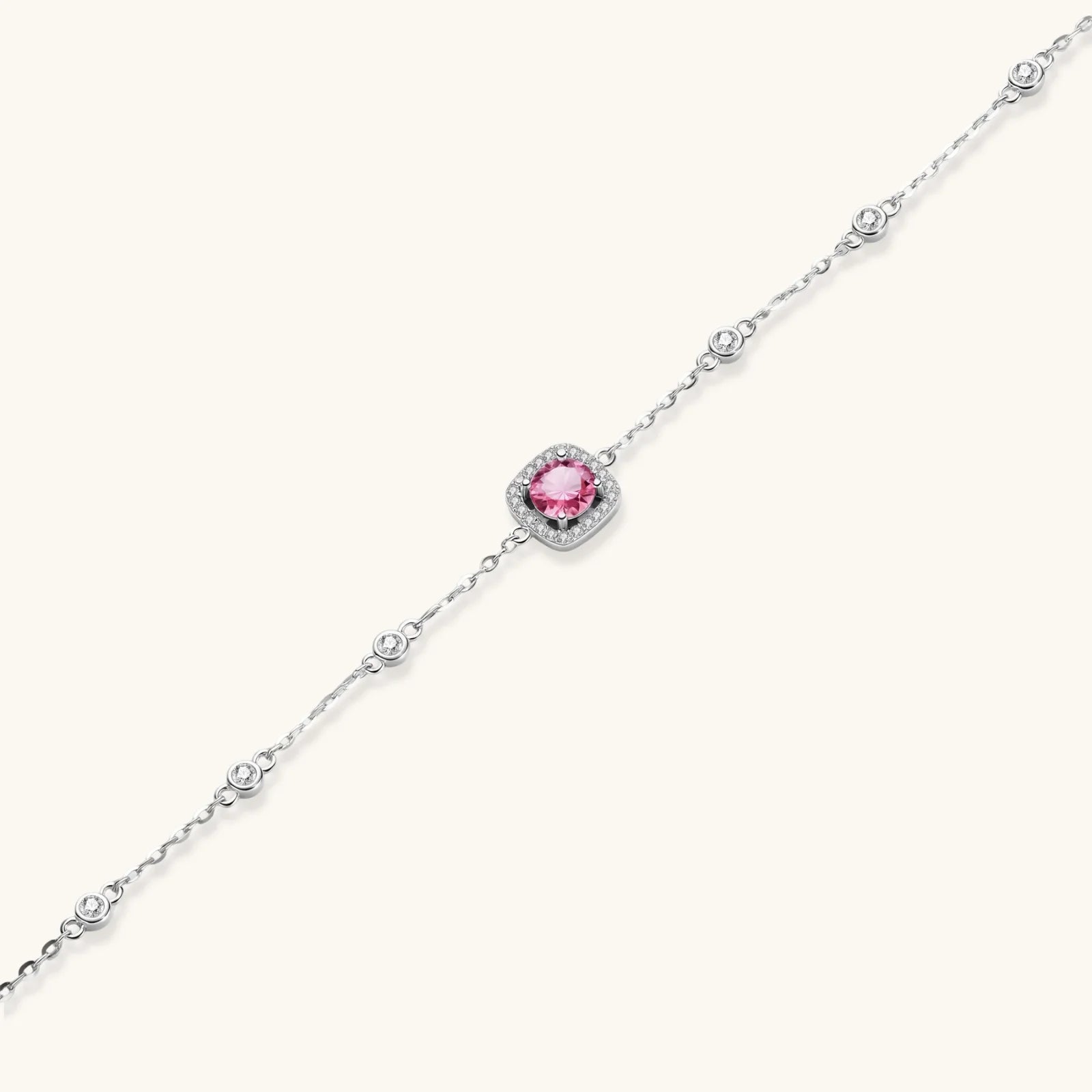 Elegant sterling silver chain bracelet featuring pink moissanite center stone in cushion halo setting with adjustable clasp