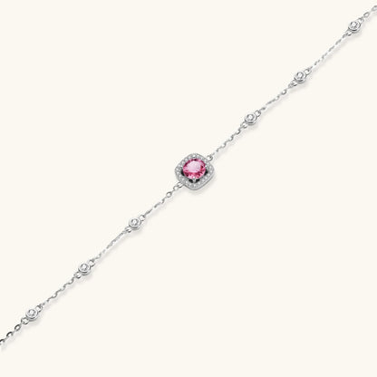 Elegant sterling silver chain bracelet featuring pink moissanite center stone in cushion halo setting with adjustable clasp