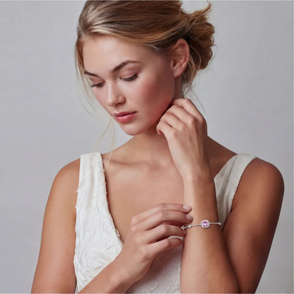 Sterling silver jewelry set featuring pink moissanite stones in halo settings on white background.