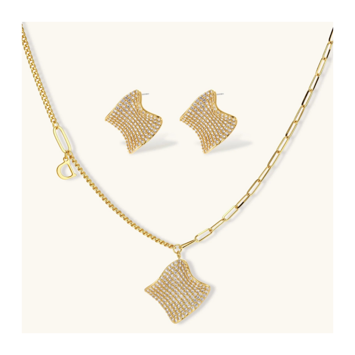 Gold-plated wavy jewelry set with crystal detailing featuring necklace with dual chains and matching textured earrings
