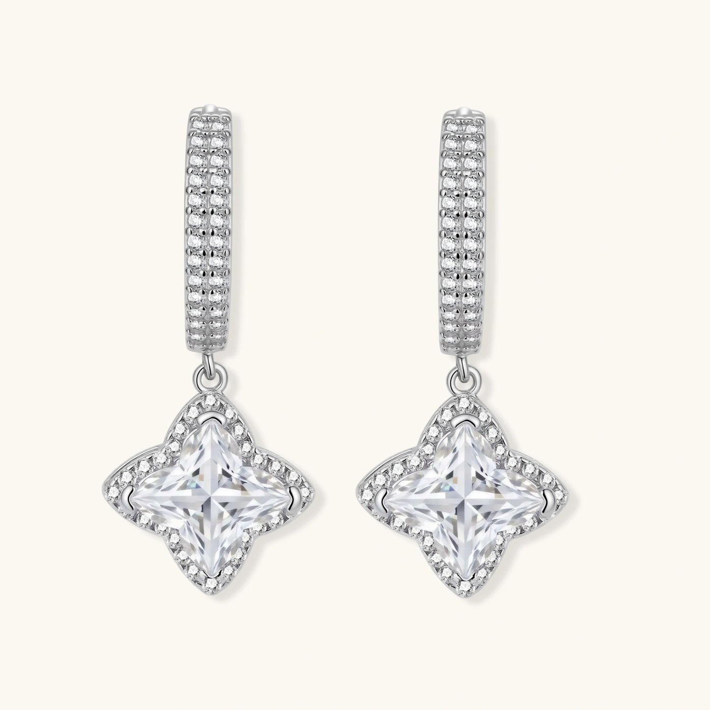 Sterling silver huggie hoops with geometric diamond-shaped moissanite dangles featuring pavé crystal details