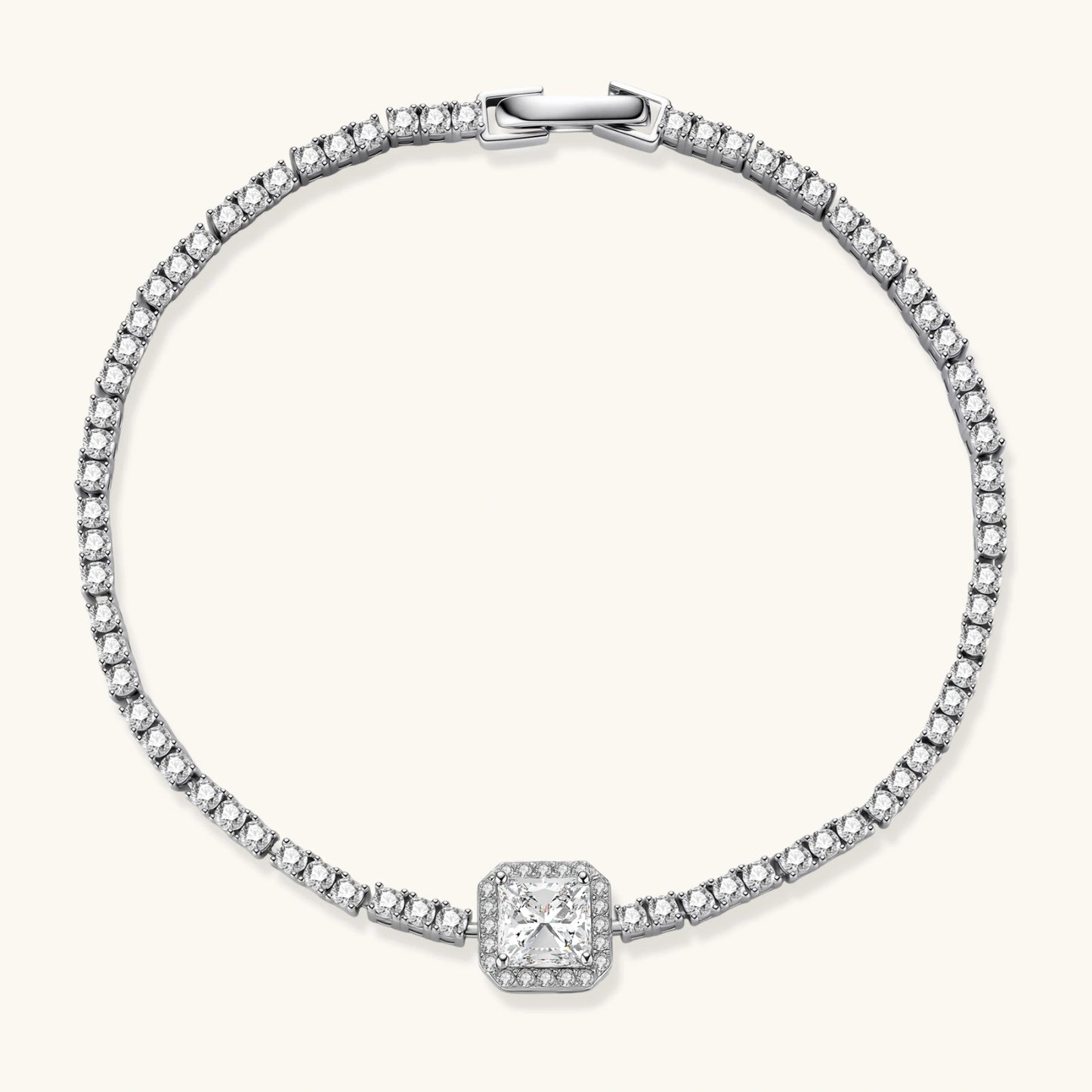 Sterling silver tennis bracelet with cushion-cut moissanite centerpiece surrounded by smaller stones in continuous setting
