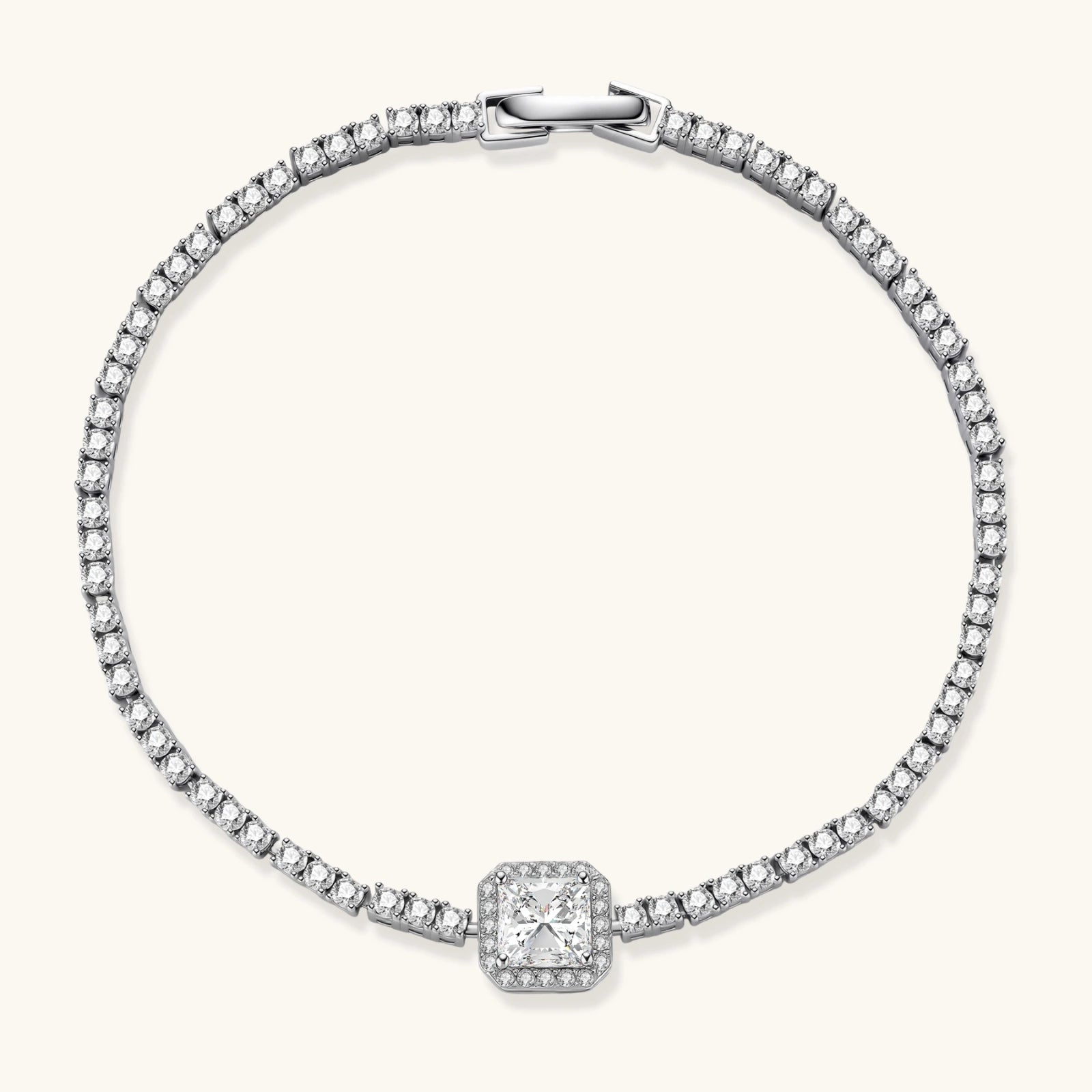 Sterling silver tennis bracelet with cushion-cut moissanite centerpiece surrounded by smaller stones in continuous setting