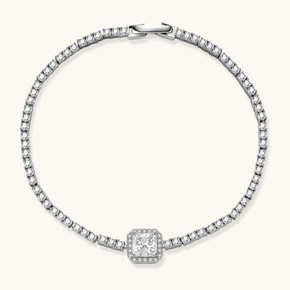 Sterling silver tennis bracelet with cushion-cut moissanite centerpiece surrounded by smaller stones in continuous setting