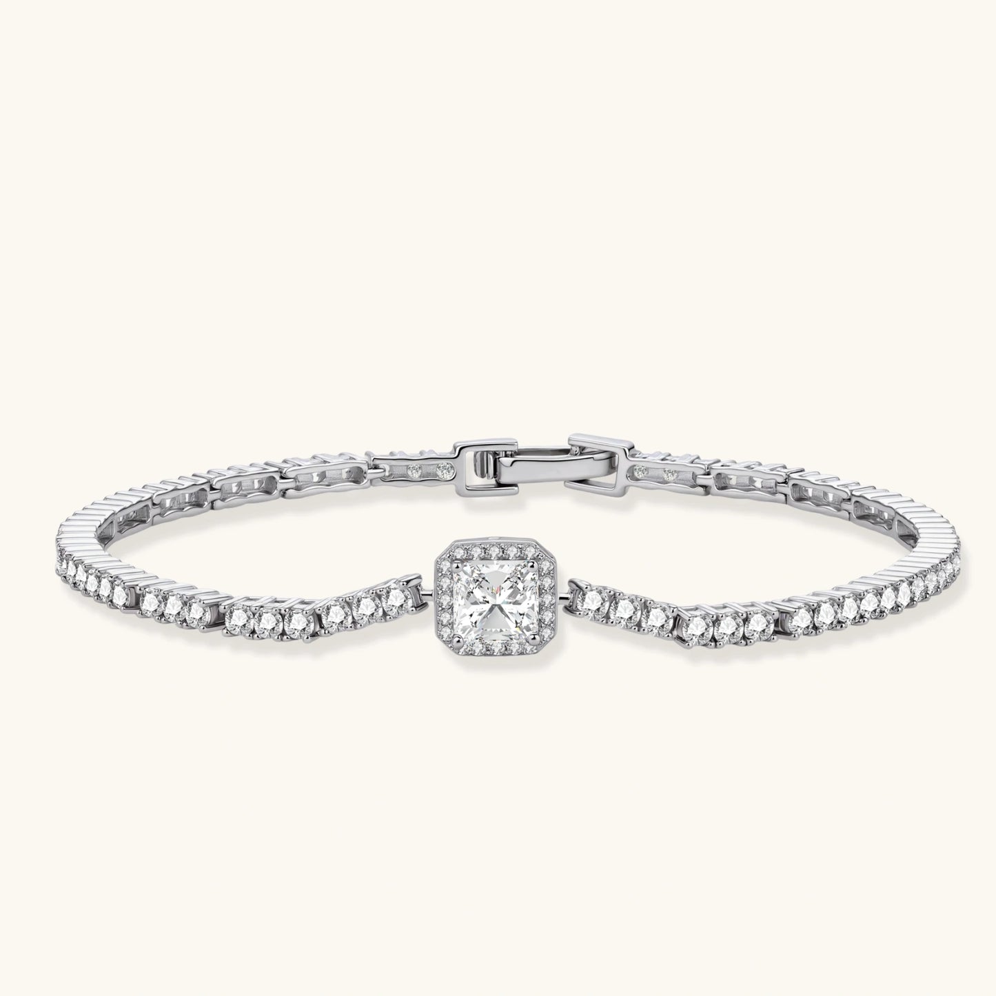 Sterling silver tennis bracelet with cushion-cut moissanite centerpiece surrounded by smaller stones in continuous setting