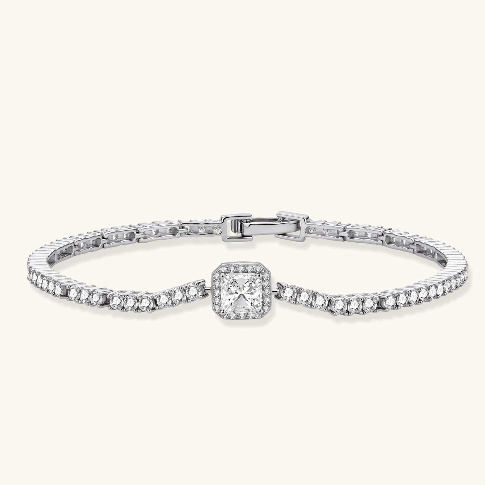 Sterling silver tennis bracelet with cushion-cut moissanite centerpiece surrounded by smaller stones in continuous setting