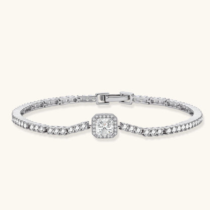 Sterling silver tennis bracelet with cushion-cut moissanite centerpiece surrounded by smaller stones in continuous setting
