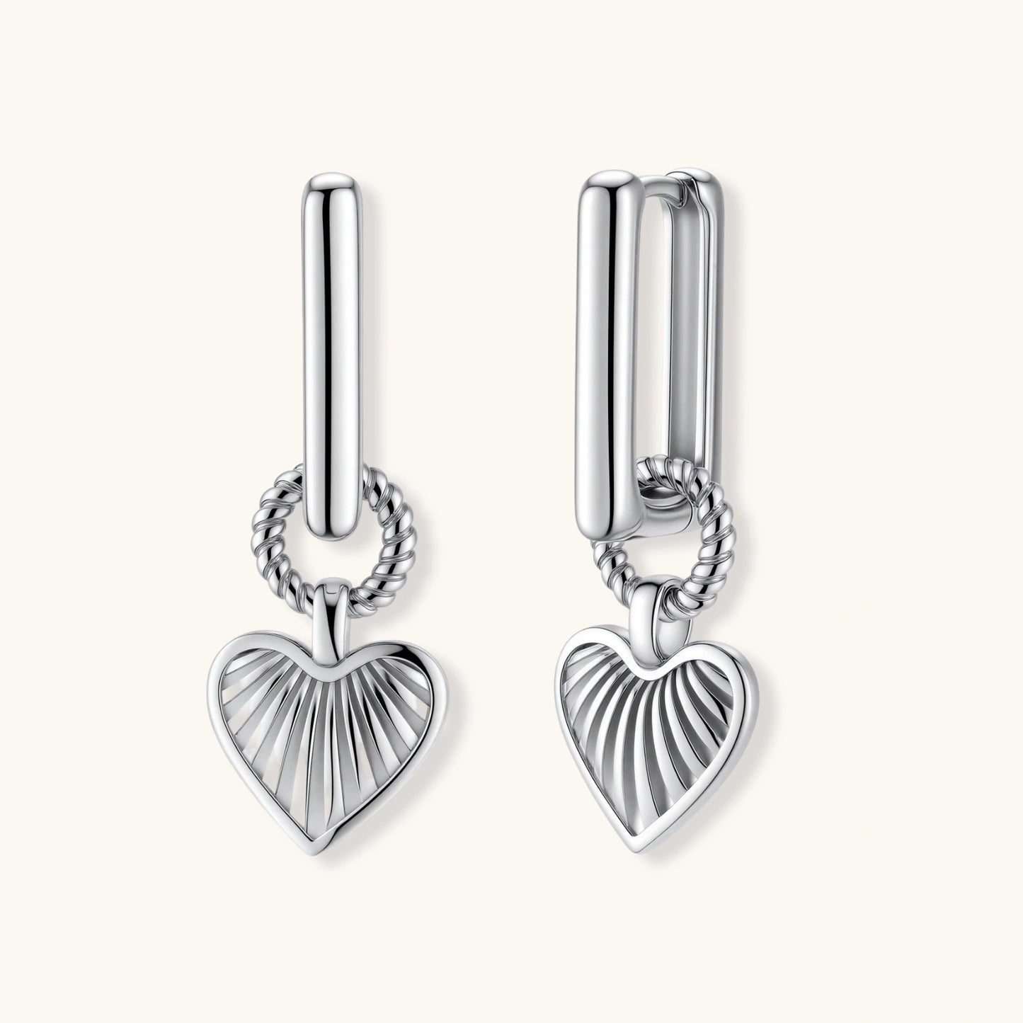 Platinum-plated 925 sterling silver rectangular hoop earrings with twisted ring connector and ribbed heart charm pendant.
