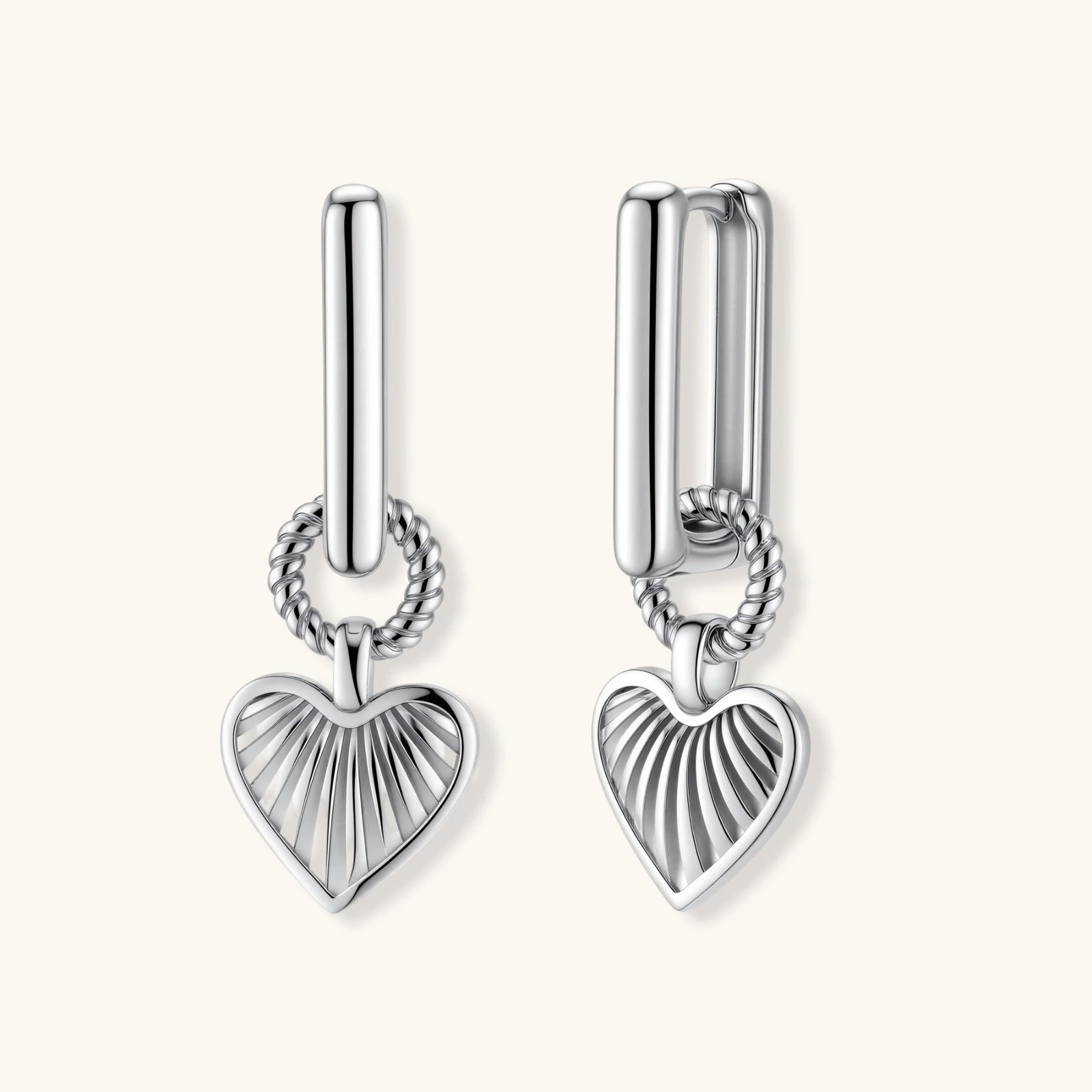 Platinum-plated 925 sterling silver rectangular hoop earrings with twisted ring connector and ribbed heart charm pendant.