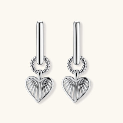 Platinum-plated 925 sterling silver rectangular hoop earrings with twisted ring connector and ribbed heart charm pendant.