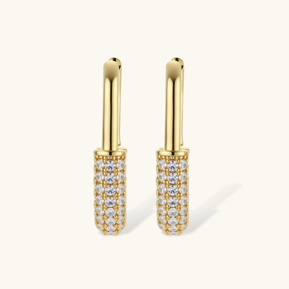 Gold-plated huggie hoop earrings with pavé zirconia stones covering the bottom curve, shown in open and closed positions.