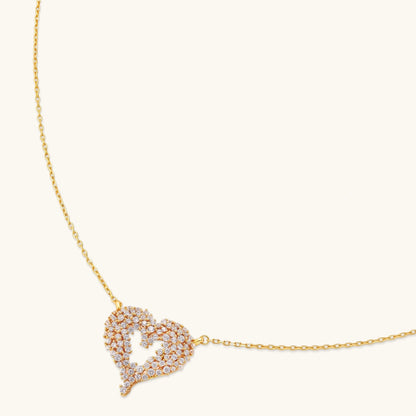 18K gold-plated 925 silver open heart pendant necklace with scattered cubic zirconia stones on a fine cable chain.
